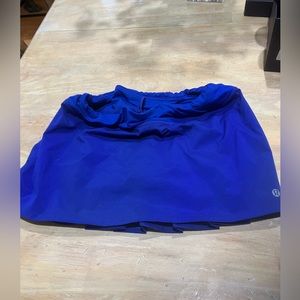 Sport skirt.Underneath attached shorts. Back is pleated. Vibrant bright blue.